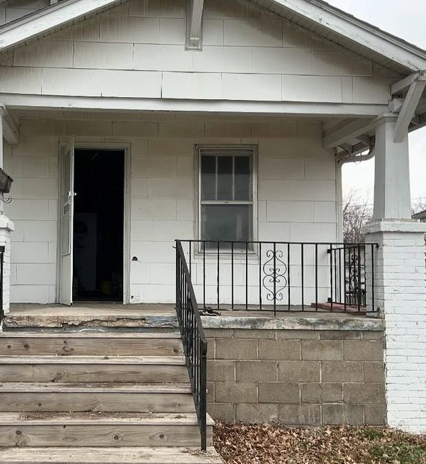 Before: a white-painted bungalow porch with peeling paint, a black iron railing with a scroll motif on a painted concrete-block porch wall, worn timber steps, and an open front door onto a dark interior.